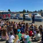 PhotoS by Casey Sires/Clallam County Fire District 3
Crew members from Clallam County Fire District 3s Station 33 talk with Greywolf Elementary School students about fire safety on June 5.