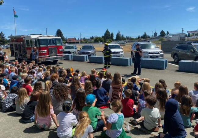 PhotoS by Casey Sires/Clallam County Fire District 3
Crew members from Clallam County Fire District 3s Station 33 talk with Greywolf Elementary School students about fire safety on June 5.