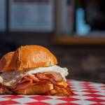 Sequim Gazette photo by Emily Matthiessen
The Whole Pig, a popular breakfast sandwich at Country Coffee and Grub in Carlsborg, features bacon, sausage, ham, fried egg and cheese on a croissant.