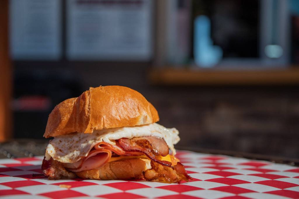 Sequim Gazette photo by Emily Matthiessen
The Whole Pig, a popular breakfast sandwich at Country Coffee and Grub in Carlsborg, features bacon, sausage, ham, fried egg and cheese on a croissant.