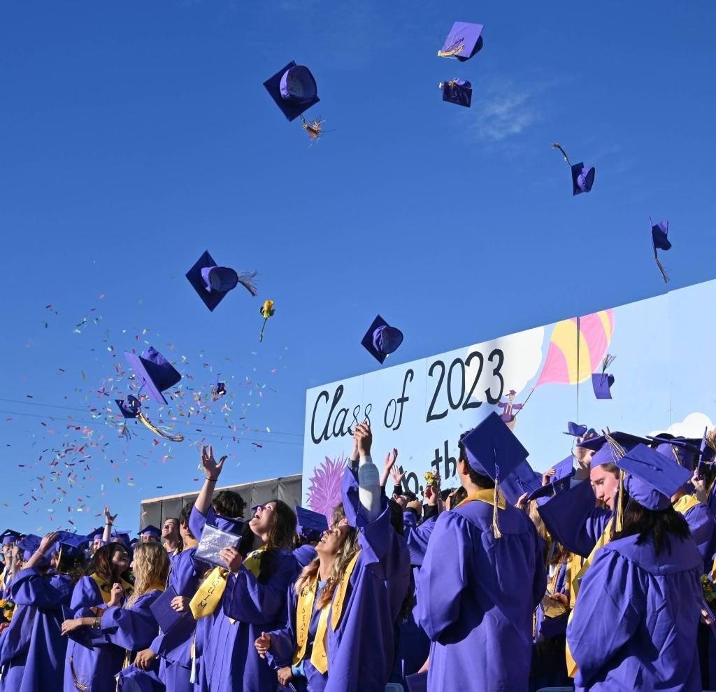 Sequim Gazette photo by Michael Dashiell / Members of Sequim High Schools Class of 2023 toss their graduation caps to the skies at the conclusion of SHSs commencement ceremony on June 16; about 166 seniors earned their diplomas that night.