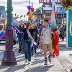 Sequim Gazette photo by Emily Matthiessen / Sequim's second annual Pride march and celebration took place on Friday evening. Grand Marshal Lorie Fazio and Pride committee volunteer David Ham lead the march up and down Washington Street with a happy crowd behind them.