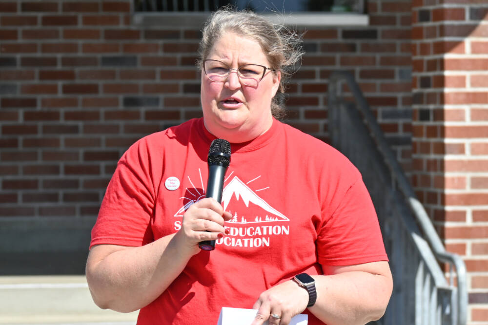 Sequim Gazette photo by Michael Dashiell / Saralyn Pozernick, president for the Sequim Education Association, speaks with fellow teachers as they gather outside the district office on May 31 during contract negotiations with administrators.