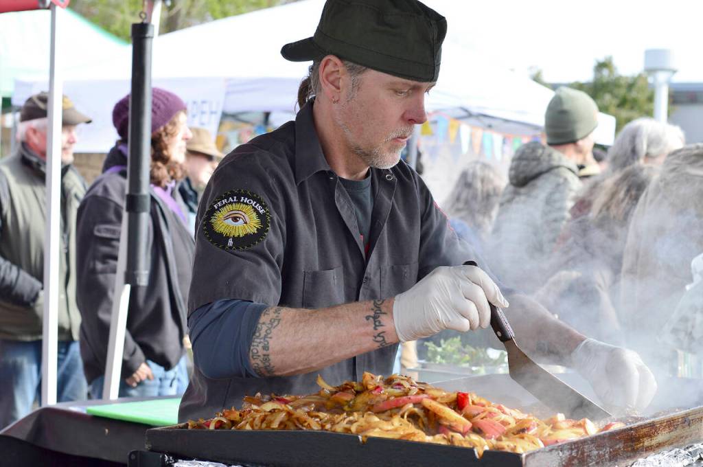 File photo by Diane Urbani de la Paz / Barbarian Fine Cuisines Chris Kauffman was among the numerous cooks working opening day of the Port Townsend Market in 2022.
