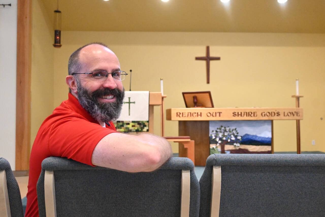 Sequim Gazette photo by Michael Dashiell 
Russ Britton enjoys a moment in the Dungeness Valley Lutheran Church sanctuary last week. Pastor of the church for almost five years, Britton and family are moving to Minnesota this July, where hell take an associate pastor role.