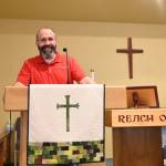 Sequim Gazette photo by Michael Dashiell / Russ Britton, pictured here inside the Dungeness Valley Lutheran Church sanctuary last week, was pastor of the church for almost five years. He, his wife and teenaged son are moving to Minnesota this July, where he'll take an associate pastor role.