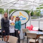 Sequim Gazette photo by Emily Matthiessen / Owners Tracie Millett and Levon Gomes, with long-term employee Maria Flores-Lewis, stand in the weather-proofed outside eating area of their latest endeavor FnChips, a Salty Girls Production.