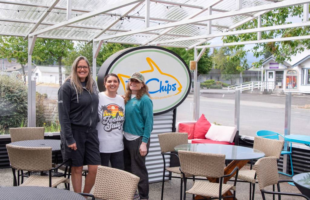 Sequim Gazette photo by Emily Matthiessen / Owners Tracie Millett and Levon Gomes, with long-term employee Maria Flores-Lewis, stand in the weather-proofed outside eating area of their latest endeavor FnChips, a Salty Girls Production.