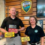 Sequim Gazette photo by Matthew Nash
Sequim deputy police chief Mike Hill and police chief Sheri Crain stand together to show their bricks they earned at the FBI National Academy. The yellow brick was for completing an obstacle course, black for weightlifting, and red for rowing achievements.