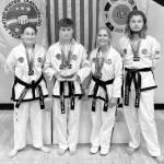 Photo courtesy of Bodystrong Taekwon-do Academy
Members of Bodystrong Taekwon-do Academy take a break from competing at the USTF Taekwon-do National Championships in Colorado in June. Pictured, from left, are Jessica Golbeck, Aron Golbeck, Linda Allen and Adrian Golbeck.