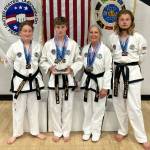 Photo courtesy of Bodystrong Taekwon-do Academy / Members of Bodystrong Taekwon-do Academy take a break from competing at the USTF Taekwon-do National Championships in Colorado in June. Pictured, from left, are Jessica Golbeck, Aron Golbeck, Linda Allen and Adrian Golbeck.