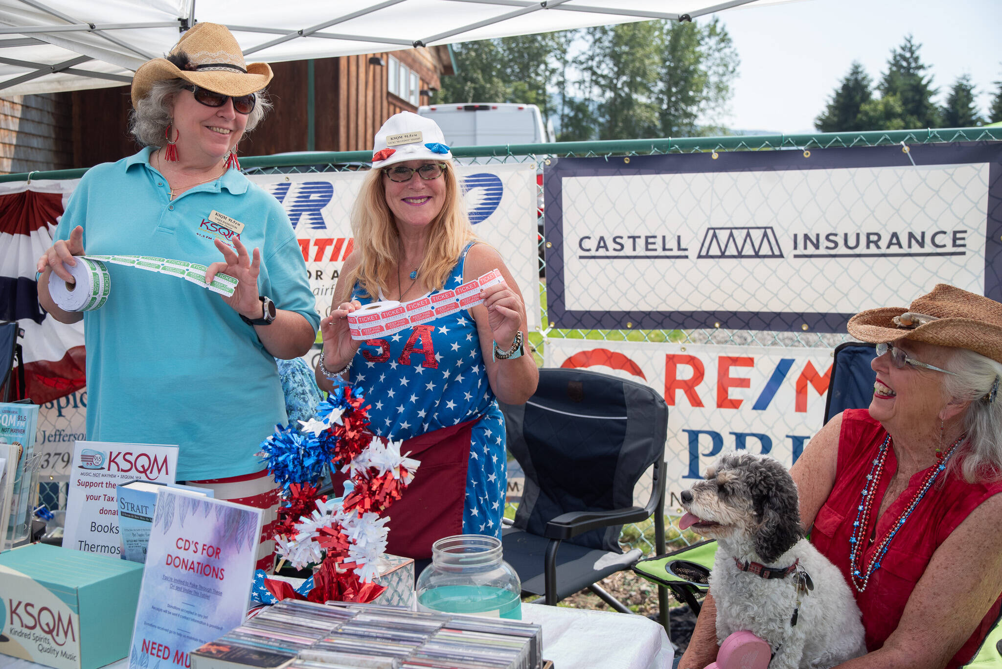 Sequim Gazette photo by Emily Matthiessen / KSQM Administrative Director Tama Bankston, Vicki Shamp, Breezy Dawson and Beverly Dawson sell raffle tickets at the KSQM booth.