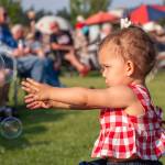 Sequim Gazette photos by Emily Matthiessen
Ember Johnson, 16-months-old, chases after bubbles at Sequims Independence Day celebration.