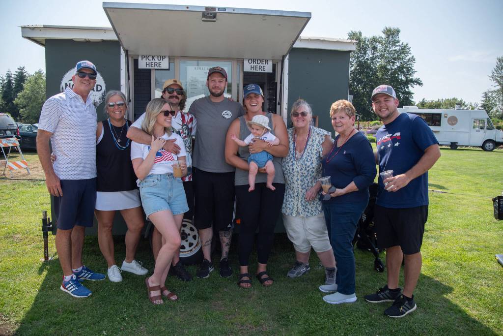 Sequim Gazette photo by Emily Matthiessen
The extended family of Megan and Dylan Heck of Nomad Coffee, showed up to celebrate the Fourth of July at Carrie Blake Community Park. Pictured, from left, are Jim White, Tami White, Alex Cocca, Luke Cocca, Dylan Heck, Megan Heck holding Lucille Cocca, Kathy Martin, Edna White and Jimmy White. Weve never all been together in the city before, Megan Heck said. It feels really special to have them all supporting our business.