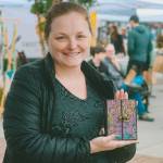 PhotoS courtesy of Sequim Farmers & Artisans Market 
Rose Crawford displays one of her one-of-a-kind composition notebooks at the Sequim Farmers & Artisans Market.