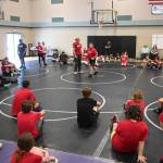Sequim Gazette photo by Michael Dashiell / Former NCAA wrestling champ Gene Mills leads a wrestling camp at Sequim Middle School last week.