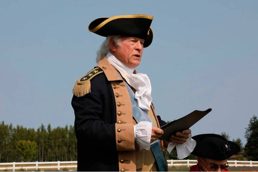 Photo courtesy George Washington Inn/ Vern Frykholm portraying George Washington speaks at an Independence Day celebration commemorating Washington Prayer Castle, a pump house that co-owner Dan Abbott believes could be classified as the worlds smallest castle.