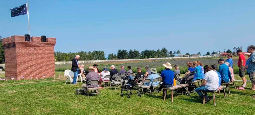 Photo courtesy George Washington Inn
Pastor David Bergen of Faith Baptist Church speaks at a July 4 dedication of the Washington Prayer Castle at George Washington Inn.