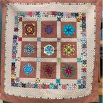 Photo courtesy of Sunbonnet Sue Quilt Club/ The 2023 Sunbonnet Sue Quilt Club raffle quilt Memories honors the memory of the late-Jeri Hight who started the brown squares in the quilt before her passing. Her friend Nancy Wilcox finished the quilt to honor Hight.