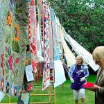 Sequim Gazette file photo by Matthew Nash/ Voting at the Sunbonnet Quilt Clubs show on July 22, pictured here in 2022, expands to include 10 different categories this year for 180-plus quilts, organizers said.