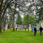 Sequim Gazette file photo by Matthew Nash
This year, organizers of the Sunbonnet Sue Quilt Clubs annual show on July 22 anticipate hanging 180-plus quilts between trees and on rafters at Pioneer Memorial Park.