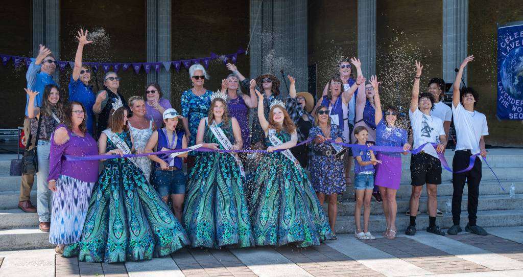 Sequim Gazette photo by Emily Matthiessen
Sequim-Dungeness Valley Chamber of Commerce members, dignitaries, community members and Irrigation Festival royalty participate in the ribbon cutting and ceremonial lavender throw during the opening of the Lavender Festival.