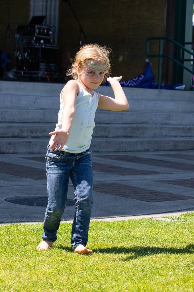 Sequim Gazette photo by Emily Matthiessen / Lilliana Robertson, 7-years-old, of Oklahoma, danced to the tunes of the WEPA Latin Trio during on Friday at the Lavender Street Fair in Carrie Blake Park.