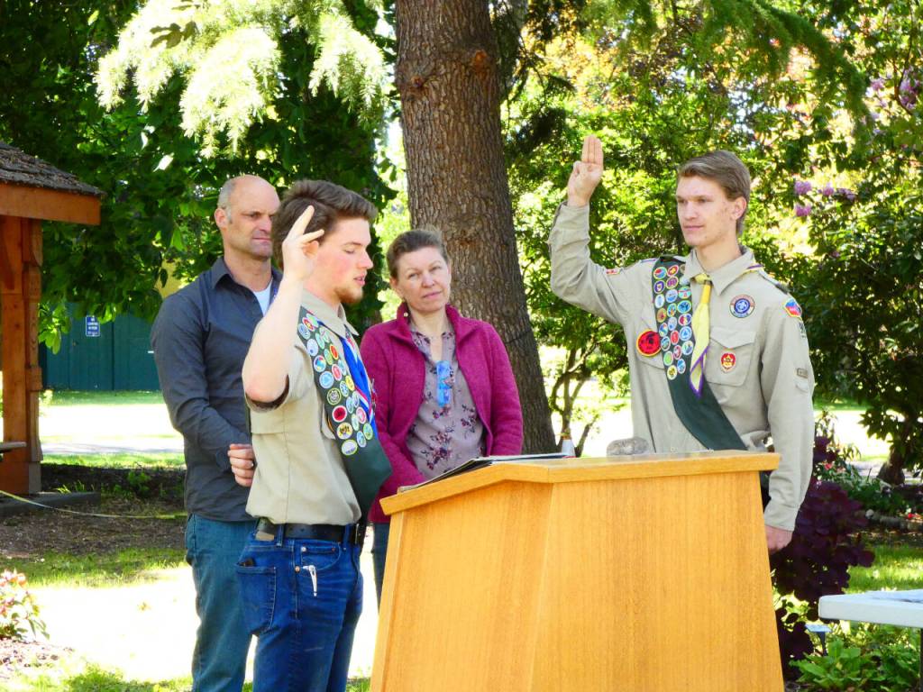 Photo courtesy of Jane Rynearson/ After completing the requirements, Dean Rynearson takes the oath to receive his Eagle Scout ranking.