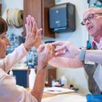 SEQUIM GAZETTE Photos by Emily Matthiessen
Sandy Pufky-Negus and her hand therapist, Aaron Staeben, share a high five as he assesses her wrists range of motion with a goniometer measurement device.