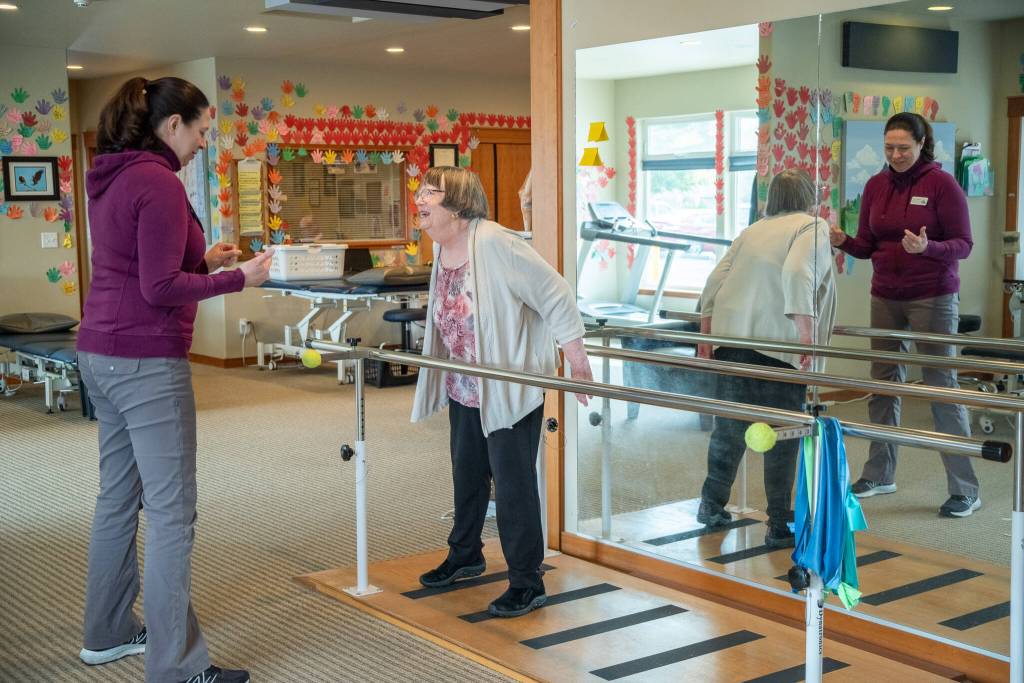 Sequim Gazette photos by Emily Matthiessen
Sarah Mattson, physical therapist and clinical manager at Peak Performance Therapy Center in Sequim, guides patient Margot Hewitt in a static balance task, utilizing an unstable surface.