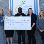 Photo courtesy of Peninsula Behavioral Health / Representatives from Peninsula Behavioral Health accept a $25,000 Community Giving Award from Coordinated Care. Pictured, from left, are: Coordinated Care president/CEO Beth Johnson; Peninsula Behavioral Health CEO Wendy Sisk; Frankie Coleman Jr., Coordinated Care community relations coordinator; Angel Dennis, Peninsula Behavioral Health development director, and Kelsey Potter, vice president of Medicaid at Coordinated Care.