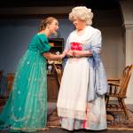 Mahina Hawley Photography / Sunshine Peterson as Lizzy Darcy thanking Mrs. Reynolds, the Pemberley Estates Housekeeper, played by Lisa Weekes in the Port Angeles Community Players 2022 production of The Wickhams Christmas at Pemberley.