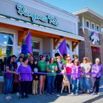 Photo by Monica Berkseth / Community members and the Sequim-Dungeness Valley Chamber of Commerce helps Dungeness Kids Co. owner Susan Baritelle, center, celebrate the business 15th anniversary on July 15 with a ribbon-cutting ceremony. The store is at 163 W. Washington St. See dungenesskids.com.