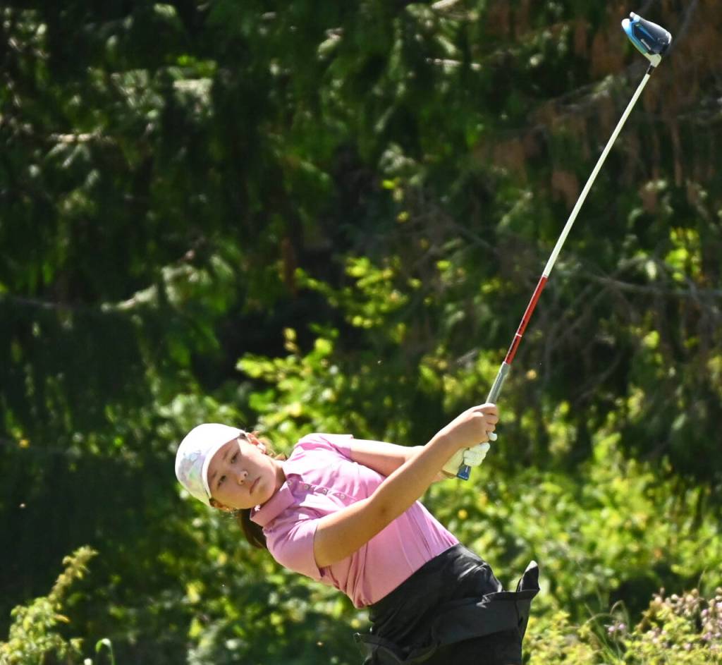 Sequim Gazette photo by Michael Dashiell / Nina Holly of Kent tees off on the second hole at The Cedars at Dungeness on July 25, in the first round of the Washington Junior Golf Associations WJGA Cup. Holly placed third in the girls 8-11 division, shooting a 13-over-par 85 over 18 holes  three shots back of division winner Lily Nguyen of Federal Way.