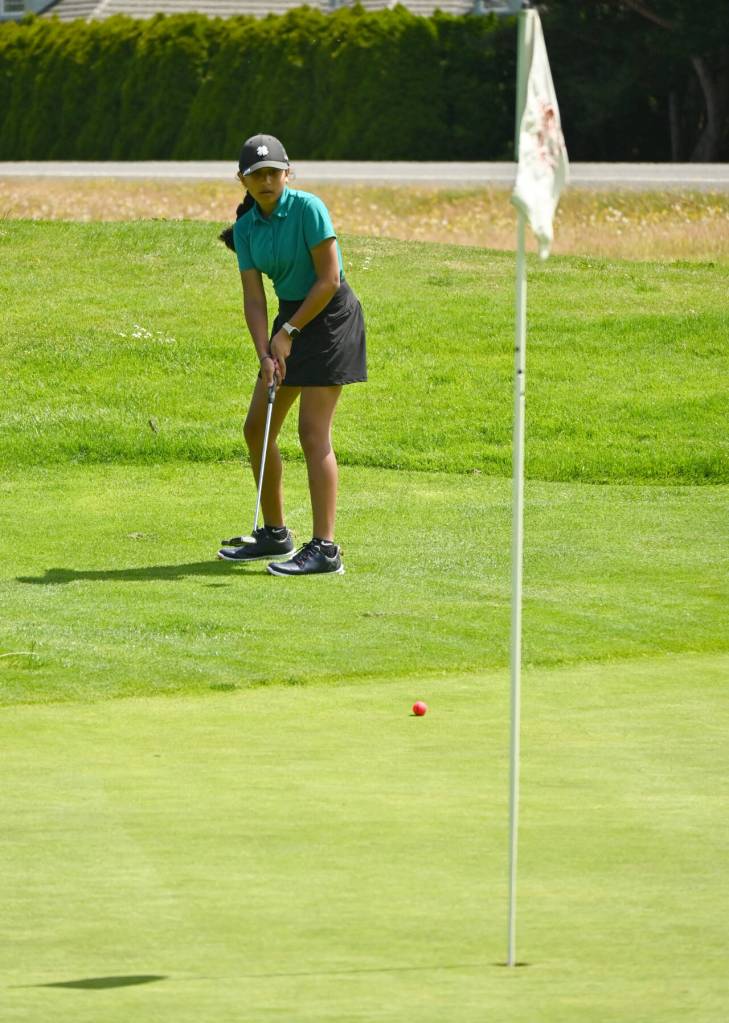 Vani Pillai of Bothell looks to sink a putt on the first hole at The Cedars at Dungeness on July 25, in the first round of the Washington Junior Golf Associations WJGA Cup. Pallai placed sixth in the girls 8-11 division.