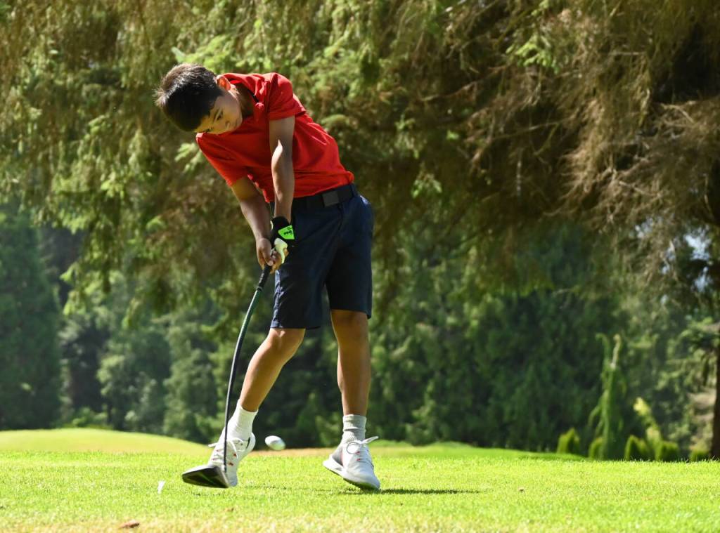 Sequim Gazette photo by Michael Dashiell / Ben Bautista of Gig Harbor hits a drive off the 10th tee at The Cedars at Dungeness on July 25. Bautista finished tied for third in the Washington Junior Golf Associations WJGA Cups boys 8-11 division, completing the 18 holes in an 8-over-par 80.