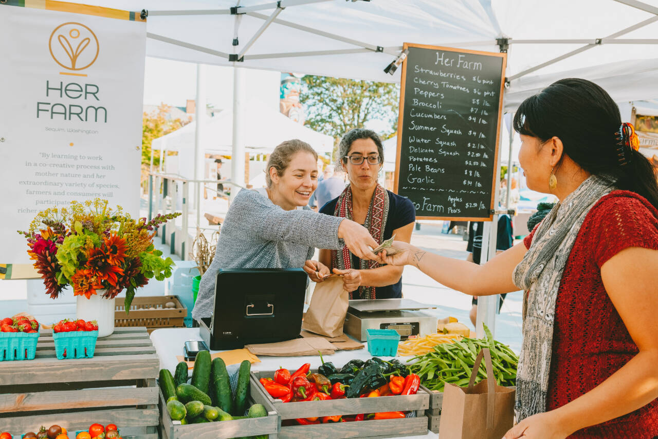 Photos courtesy of Sequim Farmers & Artisans Market/SFAM
Vendors at the farmers market provide more than an exchange of goods. Many market vendors, including those at Her Farm, are educators, teaching customers about where their products come from and how they are made.