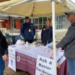 Photo courtesy of WSU Extension Clallam County Master Gardeners
Master Gardeners Ed Adams, Lorraine Eckard and Keith Dekker talk with a local gardener at the Sequim Farmers and Artisans Market Plant Clinic booth.