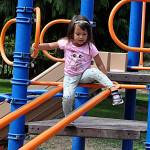 Sequim Gazette photo by Matthew Nash
Four-year-old JoJo Towarak of Sequim climbs a playground structure in Carrie Blake Community Park on Aug. 11 with her brother and grandparents. City of Sequim officials seek community input on potential redesigns of playgrounds in three city parks in order to seek grant funding.