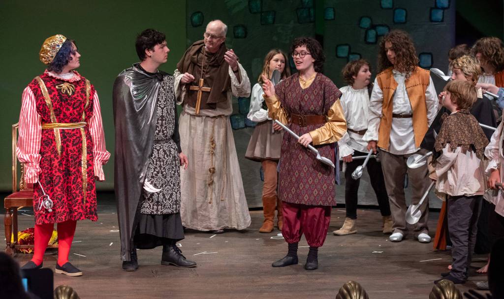 Photo by Emily Matthiessen / Sofia Rather as Will Scarlet, center, backed by the Merry Men, makes some suggestions to Prince John, left (Ivana Miller), and the Sheriff of Nottingham (Phillip McIntyre) that Bill Stone as Friar Tuck (background) considers, in OTAs upcoming play The Somewhat True Tale of Robin Hood.