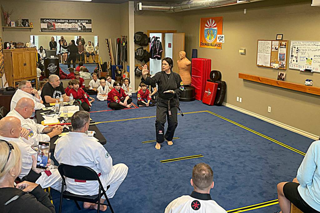 Sequim Gazette photo by Matthew Nash/ Kathrin Sumpter, owner of Sequim Martial Arts, performs a routine during the Dekimasu Alliance International Seminar on July 29. She also received her seventh degree black belt later in the day.