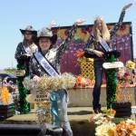 Photo by Keith Thorpe/Olympic Peninsula News Group / Clallam County Fair royalty, from left, Princess Olivia Ostlund, Queen Allison Pettit and Junior Princess Kendall Adolphe ride their festival float, which received the Irrigation Festival Chairmans Award at the Sequim Irrigation Festival in May.