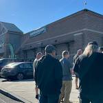 Sequim Gazette photo by Matthew Nash/ The first customers at Sequims Sportsmans Warehouse line up for the stores grand opening on the morning of Thursday, Aug. 10.