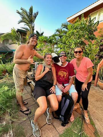 Photo courtesy of Zimmerman family / Eric and Valerye Zimmerman, left, formerly of Sequim, are reunited after running away from wildfires that ravaged Lahaina and much of Maui, Hawaii. Pictured with the Zimmermans are friends Tex, second from right, who fled the fires with Valerye, and Chenome, who is housing the Zimmermans after they lost their home.