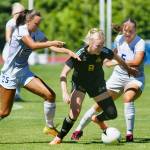 PhotoS by Rick Ross/Peninsula College
Anna Petty of Port Angeles, center, looks to keep possession in a preseason scrimmage at the University of Victoria on Aug. 13. Petty and the Pirates fell to their hosts, 4-2.