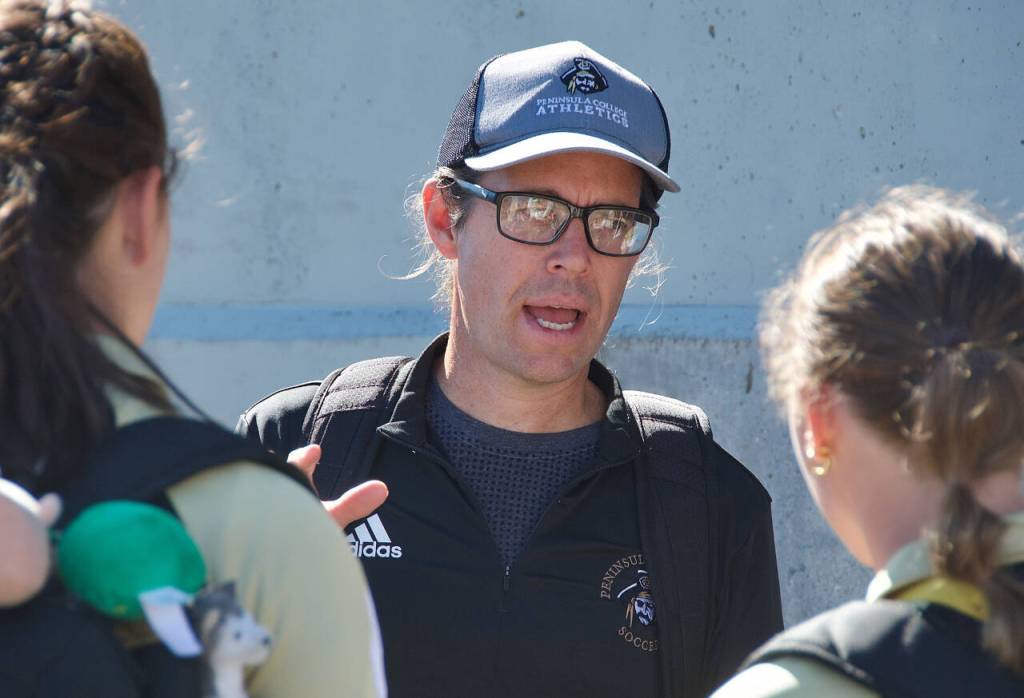 Kanyon Anderson, who had five NWAC championship titles as head coach of the Peninsula College womens soccer squad, talks to players prior to their preseason scrimmage at the University of Victoria in mid-August.