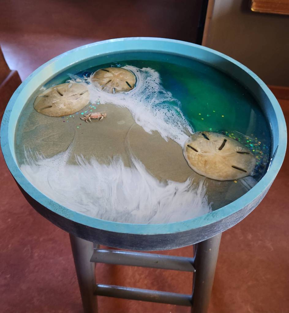 Photo courtesy of Rock Hollow Arts / Sharman Owings wood serving tray with artists resin, Diamond Point crab and sand dollars from Panama. Check out this and other artist pieces at the Rock Hollow Arts 2023 Silent Auction event on Saturday, Aug. 26.