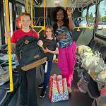 Sequim Gazette photo by Matthew Nash
Members of the Boys & Girls Club, from left, Elliana Holt, 11, Ember Handshaw, 9, and Parker-Rae Jackson, 11, help load school supplies on a Clallam Transit bus during the Stuff the Bus event on Aug. 11 outside the Sequim Walmart. Customers were provided supply lists for students to help with the Back to School Fair on Aug. 26 at the Sequim club.