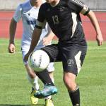 Photo by Rock Ross/Peninsula College / Peninsulas Maurin Frehner, a sophomore midfielder from Zurich, Switzerland, looks for an open teammate in the Pirates split squad scrimmage against the University of Victoria on Aug. 11.