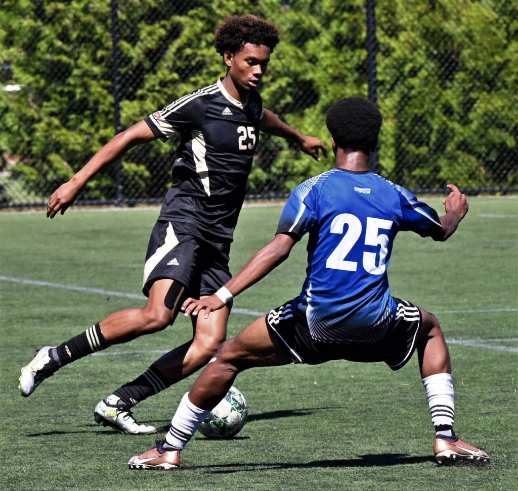 Photos by Rick Ross/Peninsula College
Peninsula Colleges Taffel McCootie, left, a sophomore defender from London, looks to get past a University of Victoria defender in an Aug. 11 scrimmage in Victoria, B.C.